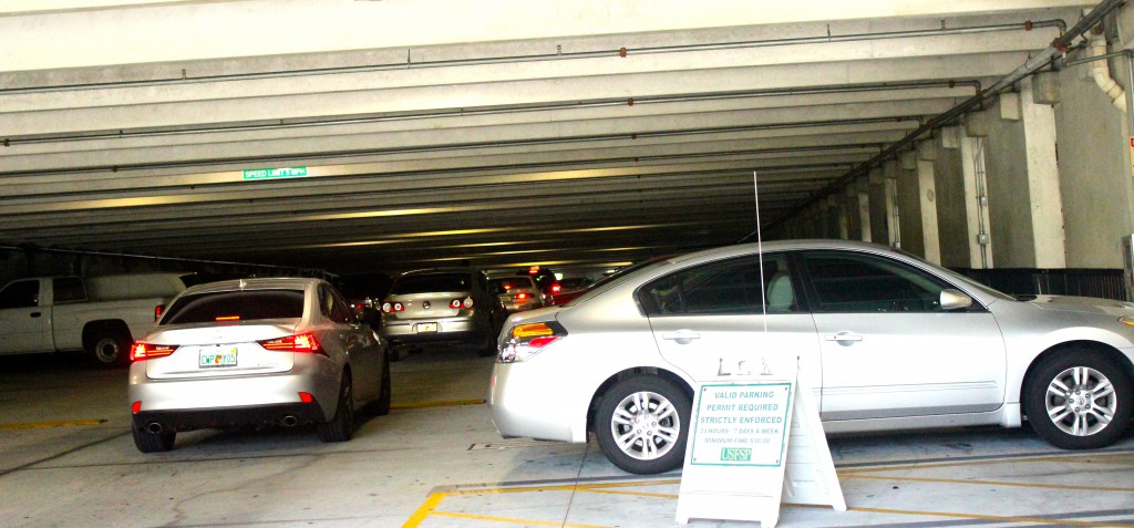 Students search for parking spaces in the garage between Fifth and Sixth Avenue S. The garage is busiest between 10 a.m. to 2 p.m., when most students come for class.