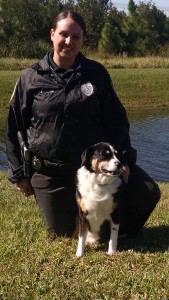 Erika Hasson, an officer in the USF St. Petersburg campus police department, poses with Bella, her Australian Shepherd mix. Hasson started school at USFSP in 2003, and she has now returned to work as an officer.