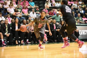 Junior guard Courtney Williams dribbles up the home court in USF’s 79-53 win over Temple.