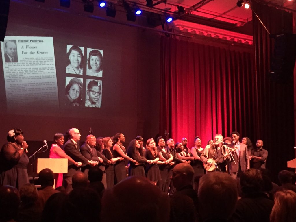 Samantha Putterman / Crow’s Nest At the end of the night, Rep. John Lewis, Roy Peter Clark and many others who brought the production to life, linked arms and sang ‘We Shall Overcome,’ a song that became a key anthem of the civil rights movement.   