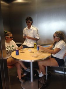 Close Friends: Tommy Meyer left, Chris Figueroa center and Mikaela Barsanti on the right sit in an elevator, participating in USFSP’s Housing’s social media contest. Courtesy of Amber Piazza