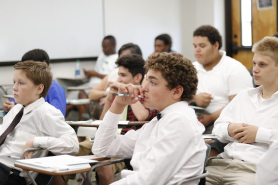 Motivated Minds: Jason Johnson (left) and Brian Perez (right) are from the North Tampa EPIC Center. They sit in a college classroom for the first time at USFSP. The boys were asked a series of questions about their goals and shown motivational videos that discussed how to achieve them. 