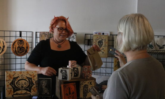 Devilish Dealer: Coralette Damme’s (left) favorite holiday is Halloween. Her passion for the macabre led her to begin Hauntizaar, a craft fair for artists at Studio@620. Damme has run a similar event, the Holizaar, a winter holiday themed fair, for the past seven years.