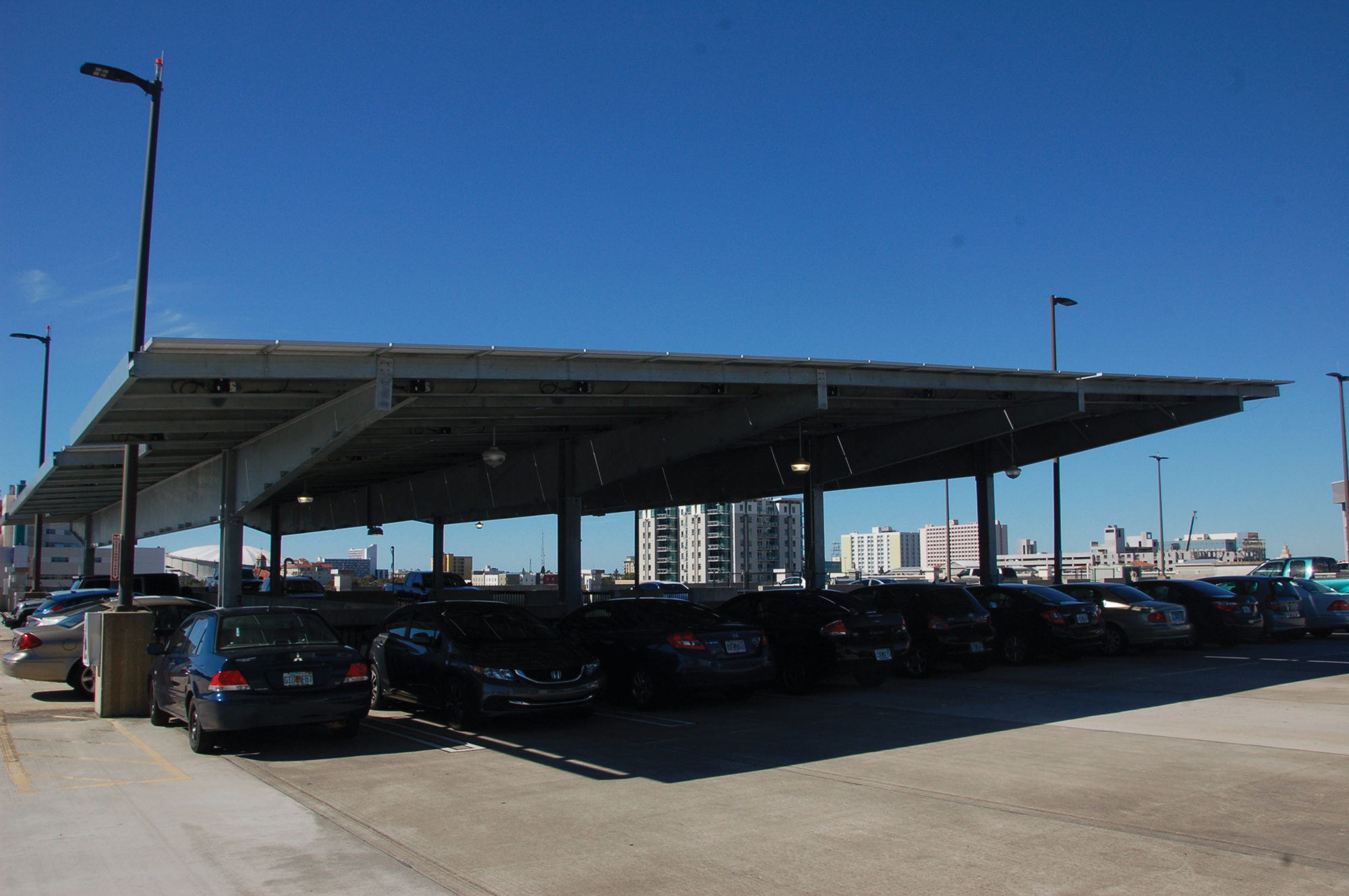 Solar Power: The installation of of new solar car ports, like the ones shown above from the parking garage, will be the first project to contribute to the Green Revolving Fund. Delaney Brown | The Crow's Nest