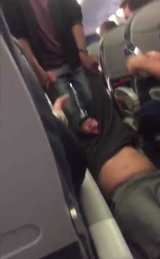 Dragged Dao: One passenger recorded the scene of Dao being forced from the plane by security. Courtesy of Storyful News